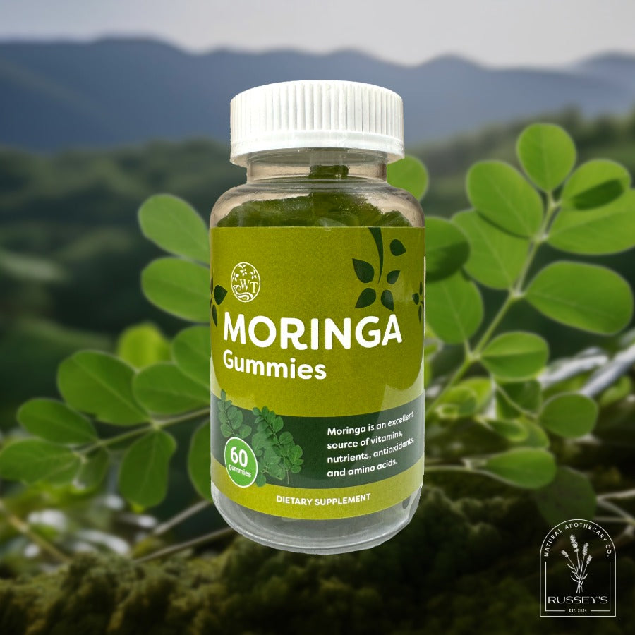 Bottle of Moringa Gummies with a natural green background