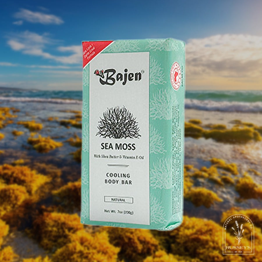 Bajen Tea Tree Purifying Body Bar packaging with a bottle of tea tree oil in the background.