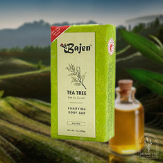 Bajen Tea Tree Purifying Body Bar packaging with a bottle of tea tree oil in the background.