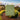 Bar of Australian Bela natural soap on a scenic background with lemon myrtles.